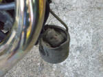 Why did someone put a doll's head in a piston and hang it from the exhaust